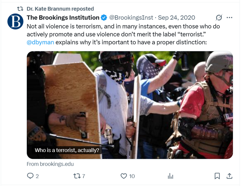 Dr. Kate Brannum reposts a Brookings Institution tweet featuring armed protestors with shields and masks. The message argues that not all violent actors are terrorists, revealing her selective interpretation of terrorism.