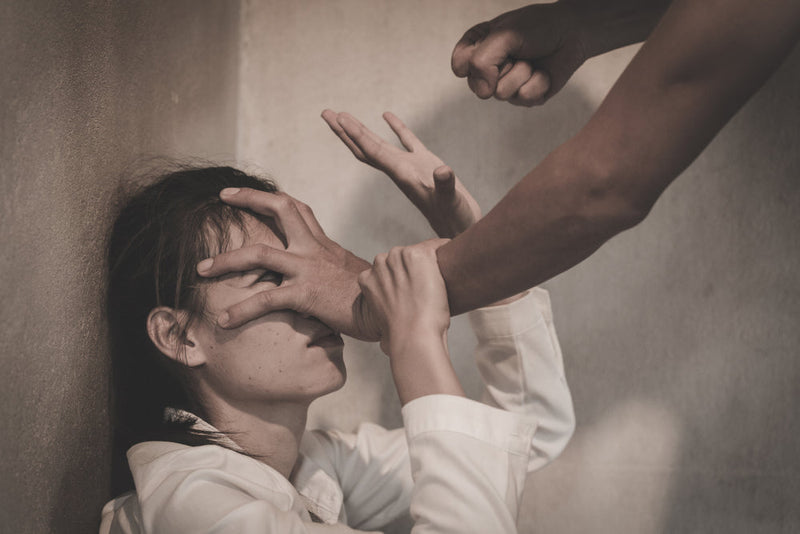 Candle Face Victim 32: A woman in distress, struggling against an assailant whose hands forcefully cover her eyes, with a clenched fist raised. A depiction of fear and helplessness, reflecting the haunting story of Candle Face’s victims.