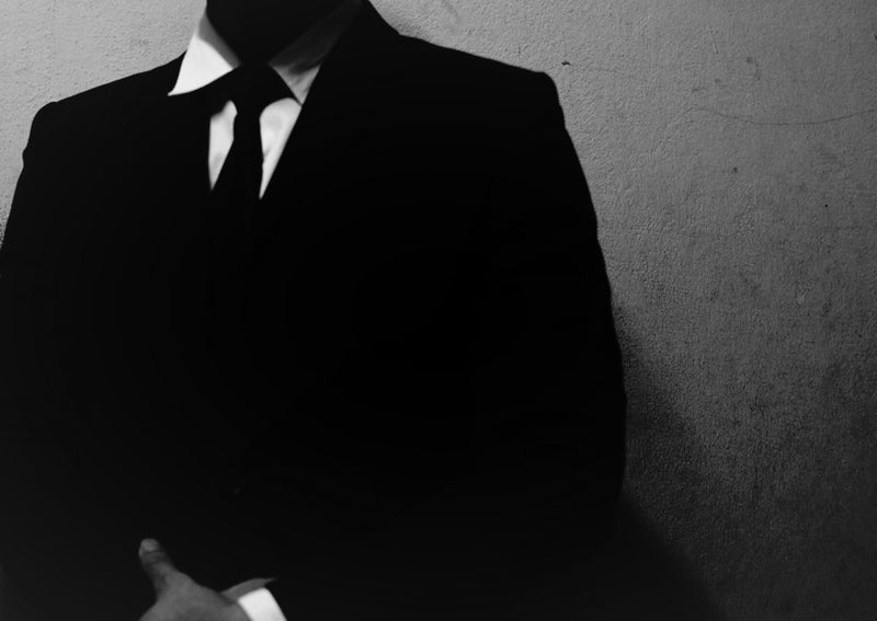 From the journal entry 'Candle Face Victim #6: The Businessman's Dark Fate,' this image captures the ominous descent of a skeptic who ignored the warnings. A shadowed figure in a suit stands against a cold wall, symbolizing the moment disbelief turns into