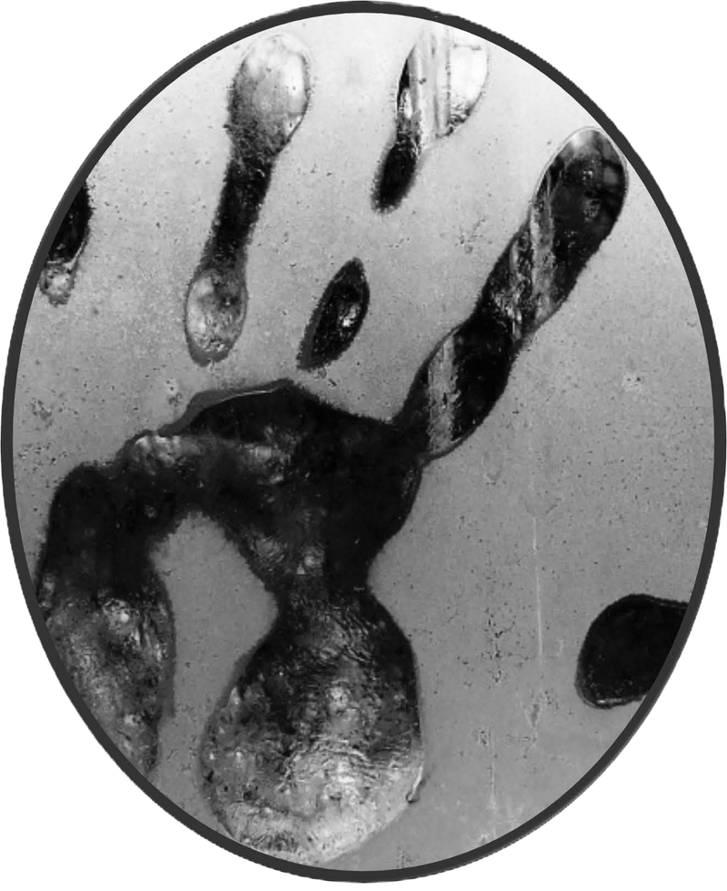 A blackened, distorted handprint pressed against a foggy glass surface. The imprint evokes the presence of Candle Face, hinting at her lingering influence and the fear she instills.