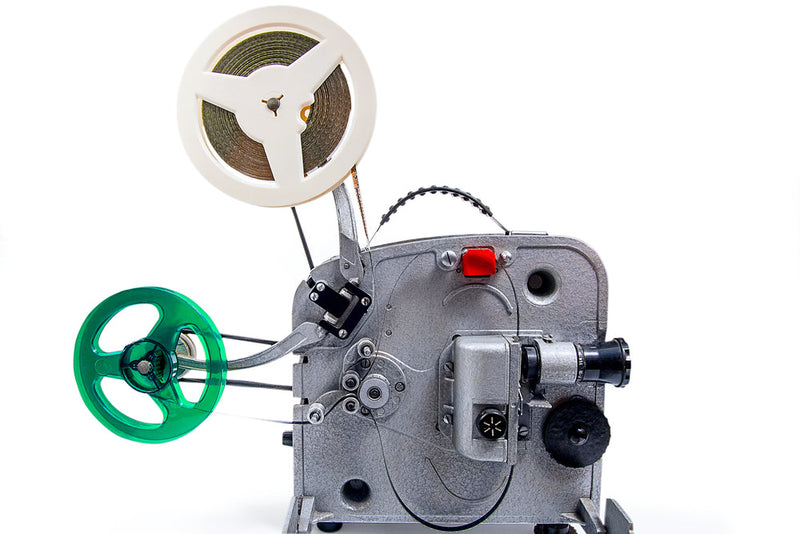 Vintage film projector with reels, symbolizing how Storyboarder.ai feels stuck in the 1920s silent film era without modern audio features.