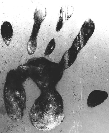 A ghostly black-and-white handprint pressed against a fogged or icy surface, evoking a creepy presence. Part of Candle Face Chronicles, symbolizing Candle Face's evil touch.